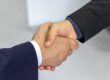 Two businessmen shaking hands after an agreement