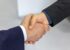 Two businessmen shaking hands after an agreement
