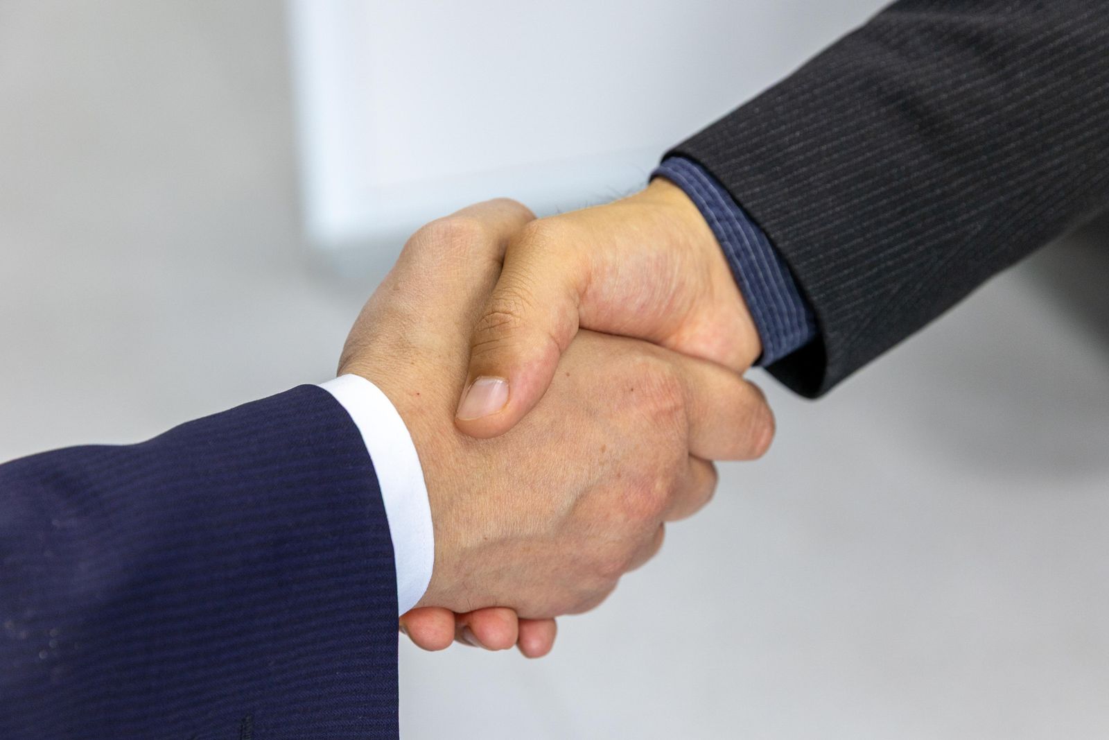 Two businessmen shaking hands after an agreement Two businessmen shaking hands after an agreement