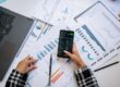 Charts and smartphone used for data analysis