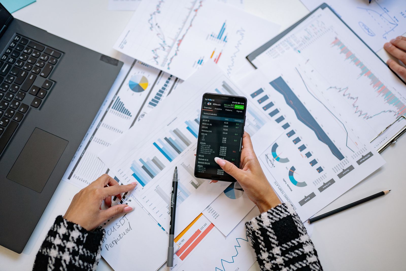 Charts and smartphone used for data analysis
